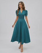 Zahara Midi Dress Teal midi dress with puff sleeves, flattering V-neck, and cinched waist by Lauven, perfect for weddings.