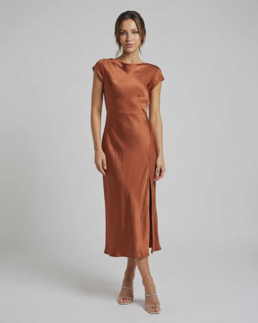 Seren Midi Dress in rich rust with elegant satin, twisted-back, cutout detail, and flattering fit by Lauven.