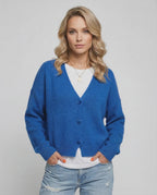 Nova Cardigan by Lauven in vibrant blue worn by a model, perfect for effortless layering and style.