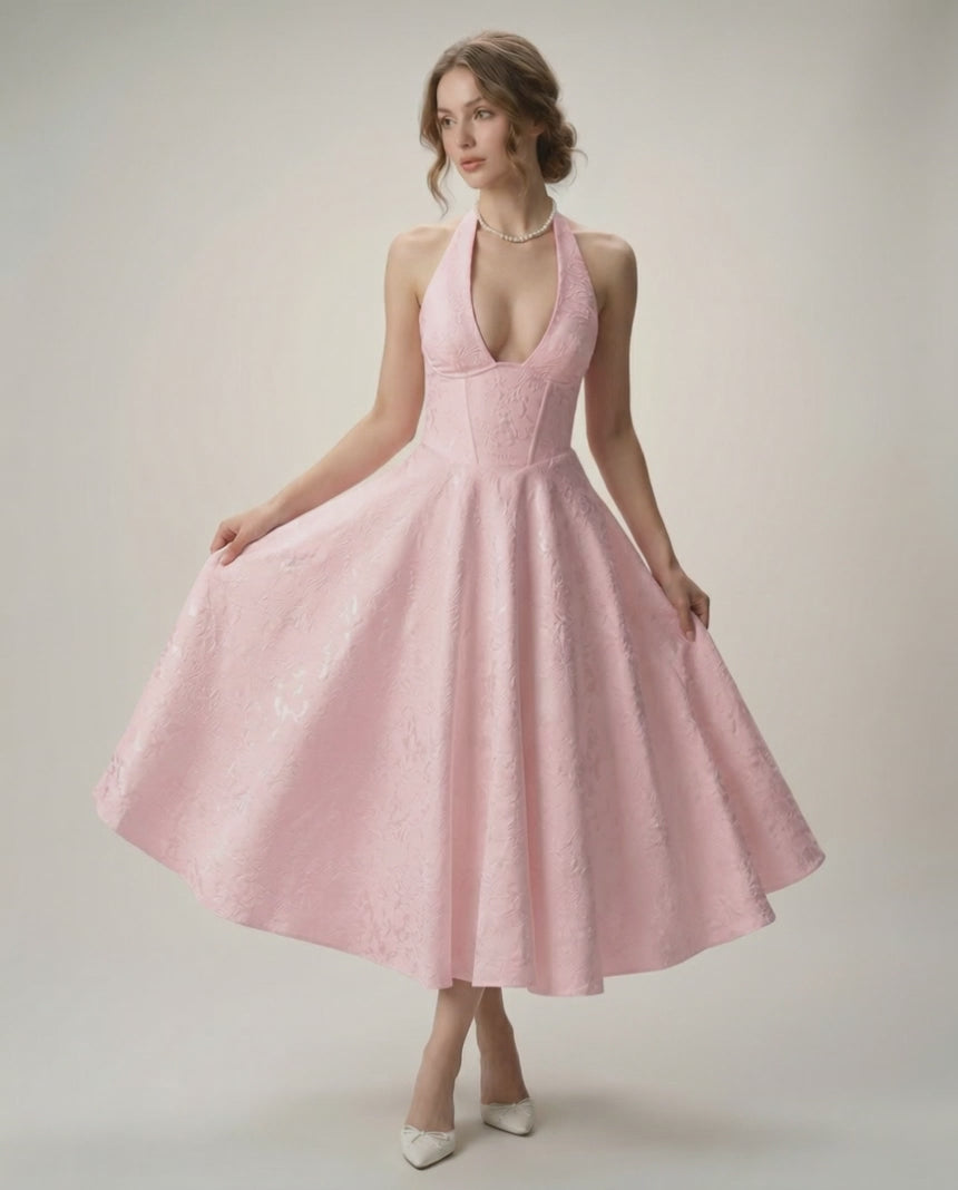 Elara Midi Dress in soft pink, featuring a halter neckline, A-line silhouette, and elegant structured fit by Lauven.