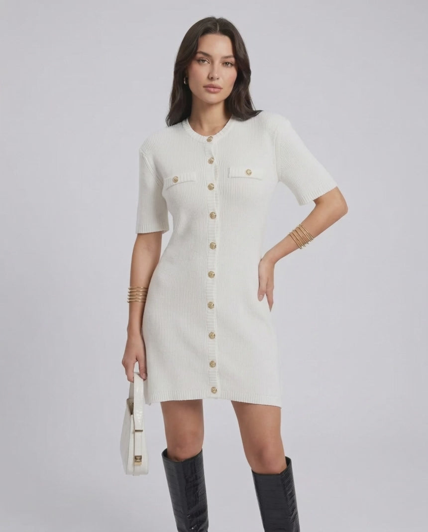 Model wearing the Elysia Mini Dress by Lauven, featuring a casual knit design and single-breasted button closure.