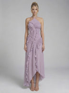 Model wearing the Luna Maxi Dress by Lauven, a soft lavender pleated halter neck gown with ruffles and a flowing silhouette.