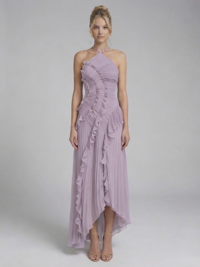 Model wearing the Luna Maxi Dress by Lauven, a soft lavender pleated halter neck gown with ruffles and a flowing silhouette.