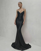 Monaco Maxi Dress featuring sleek black satin, lace-up back, V-neck silhouette, and crafted by Lauven for a stunning look.
