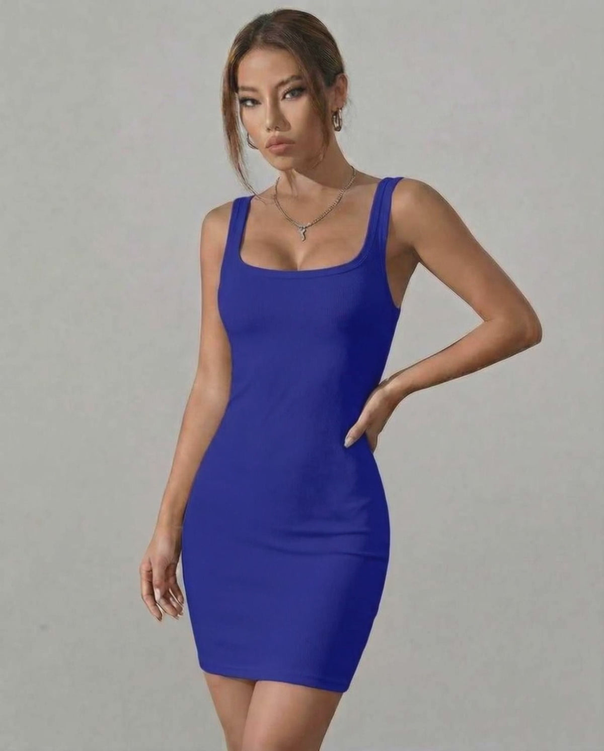 Indigo Mini Dress by Lauven in vibrant blue ribbed knit with sleek square neckline and sleeveless design.