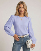 Luna Blouse by Lauven in soft lavender featuring elegant pleats and bishop sleeves for a chic look.