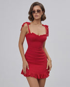 Scarlet Mini Dress by Lauven featuring spaghetti straps and ruffled hem for a stylish summer look.