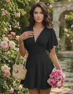 Elara Mini Dress in black chiffon blend, V-neckline, A-line silhouette with a ruched bust by Lauven, perfect for warm weather.