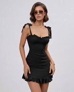 Raven Mini Dress by Lauven in Classic Black with Ruffle Details, adjustable spaghetti straps and feminine silhouette.