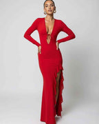 Valencia Maxi Dress in red featuring a deep V-neck, ruffle slit detail, and long sleeves by Lauven.