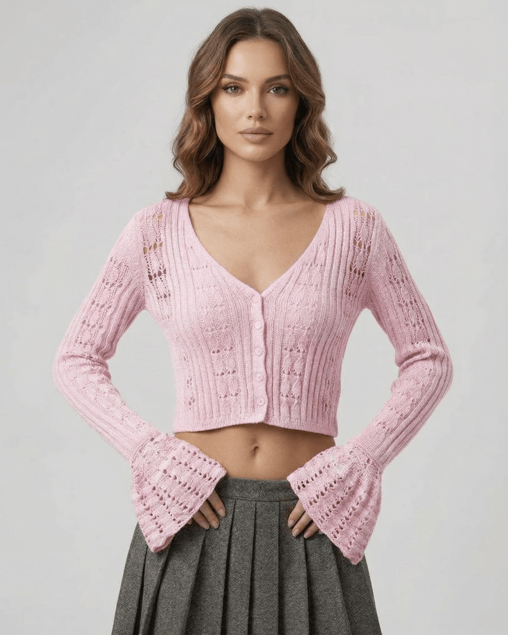 Roselle Cardigan in soft pink, featuring a cropped silhouette and openwork knit by Lauven for effortless style.