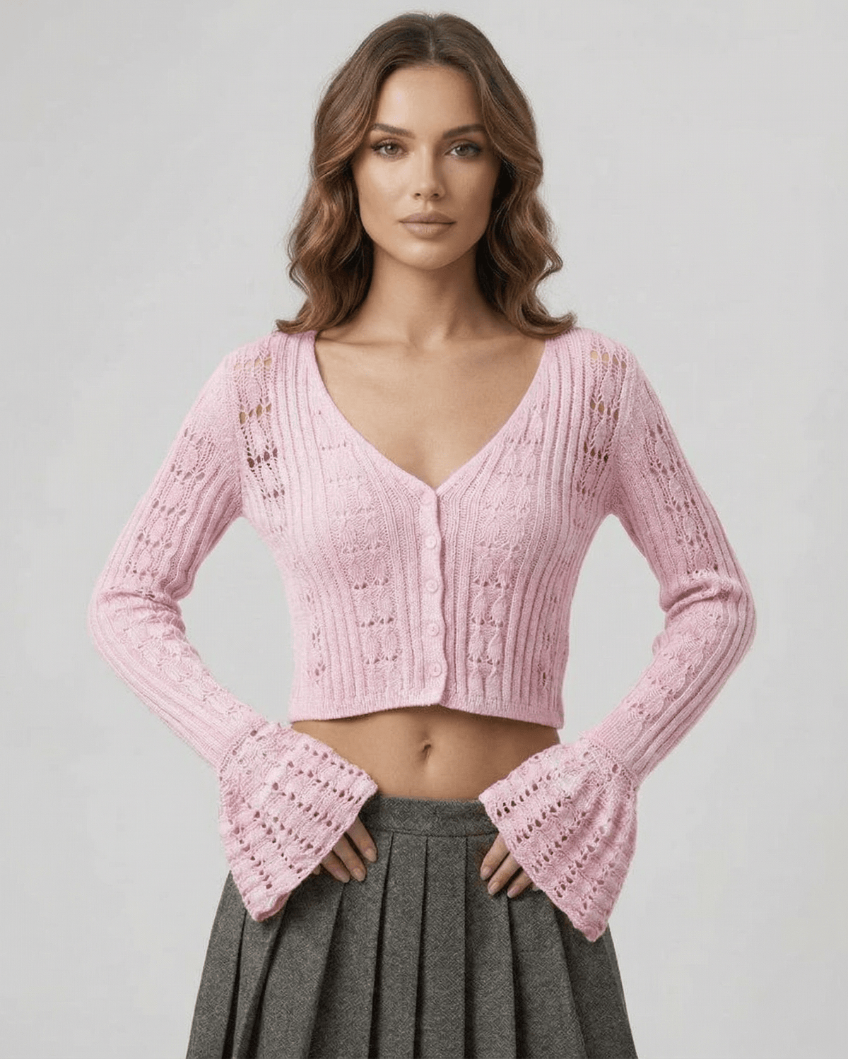 Roselle Cardigan in soft pink, featuring a cropped silhouette and openwork knit by Lauven for effortless style.