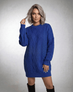 Model wearing Lauven Royal Mini Dress in deep blue cable knit with relaxed fit and ribbed trims.