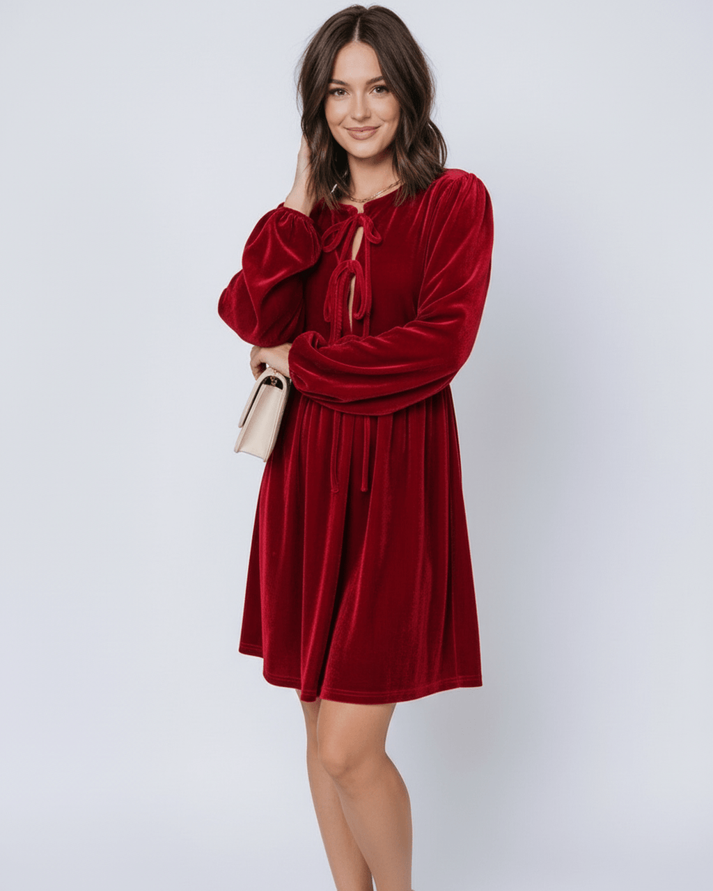 Ruby Mini Dress by Lauven featuring elegant red velvet fabric with lantern sleeves and a flowing skirt.