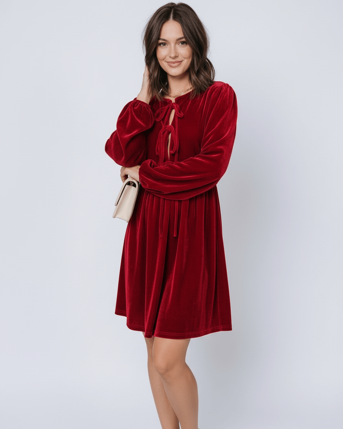 Ruby Mini Dress by Lauven featuring elegant red velvet fabric with lantern sleeves and a flowing skirt.