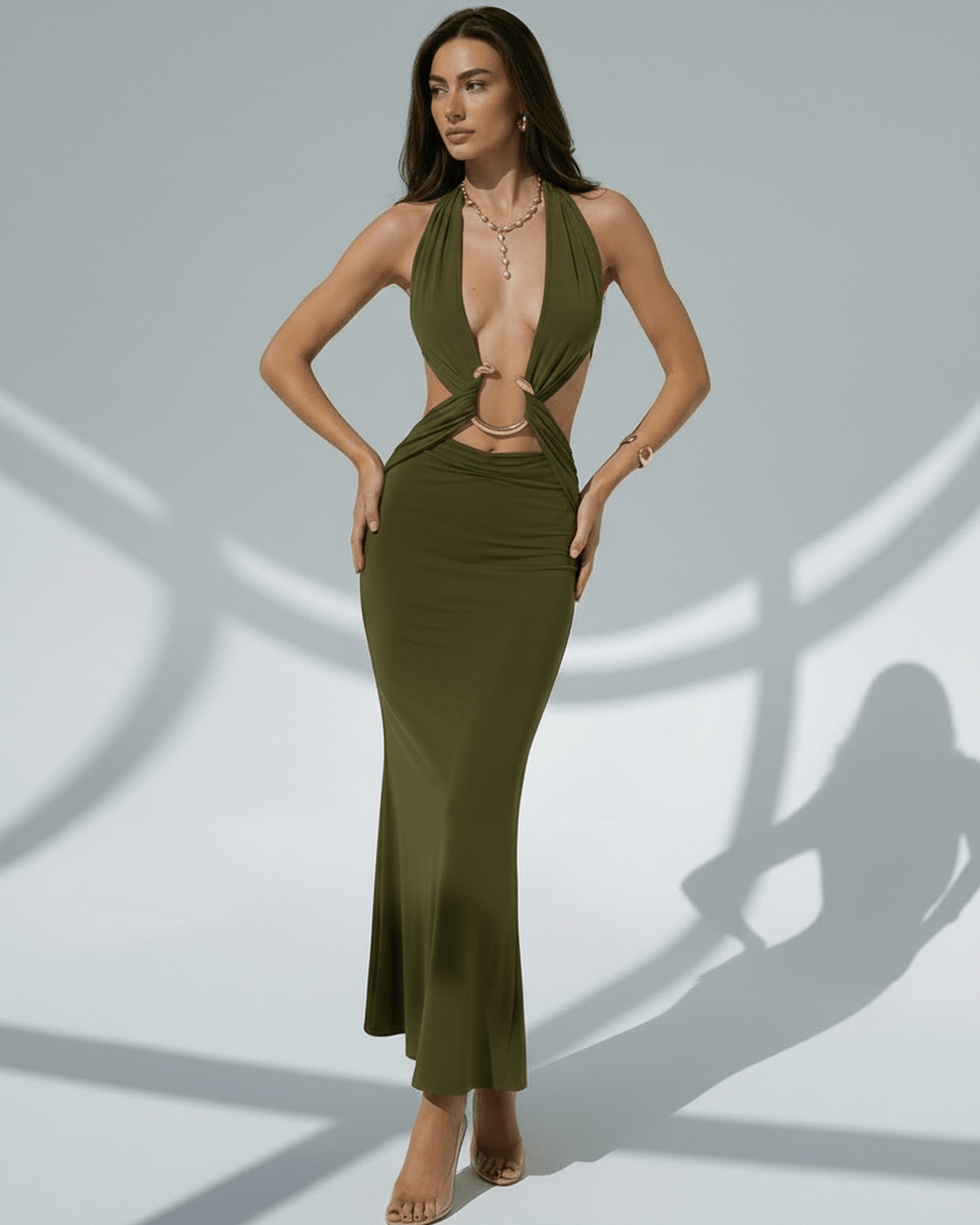 Sage Maxi Dress in olive green, featuring a deep V-neck, metal ring details, and adjustable waist for a luxurious fit.