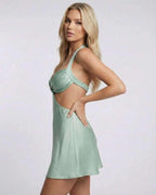 Sage Mini Dress by Lauven, featuring a halter neck and cut-out detail in soft sage satin.