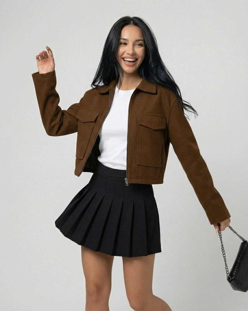 Women wearing Sahara Jacket by Lauven, a stylish brown jacket with a polo collar, paired with a black skirt.