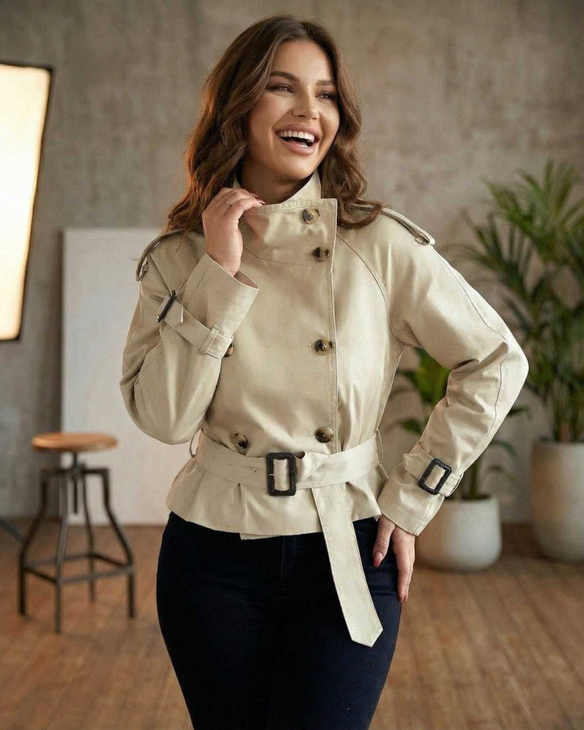 Savona Jacket by Lauven – Women's beige double breasted belted trench jacket with a flattering peplum design.