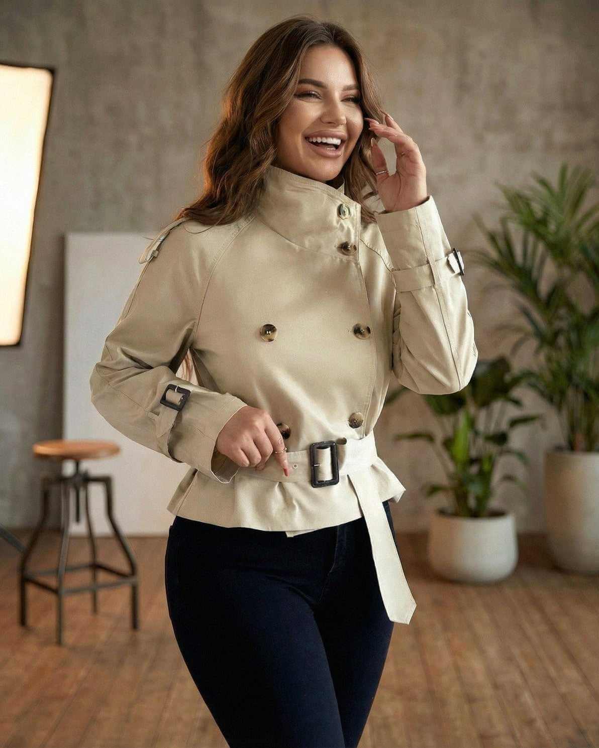Savona Jacket by Lauven – Women’s beige double breasted belted trench jacket with peplum detail, perfect for stylish outerwear.