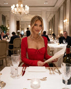 Scarlet Mini Dress: Bold red long sleeve dress with ruched bow detail, chic elegance for dining occasions, by Lauven.