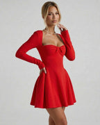 Scarlet Mini Dress by Lauven, bold red long sleeve dress with square neckline, ruched bow detail, chic silhouette.