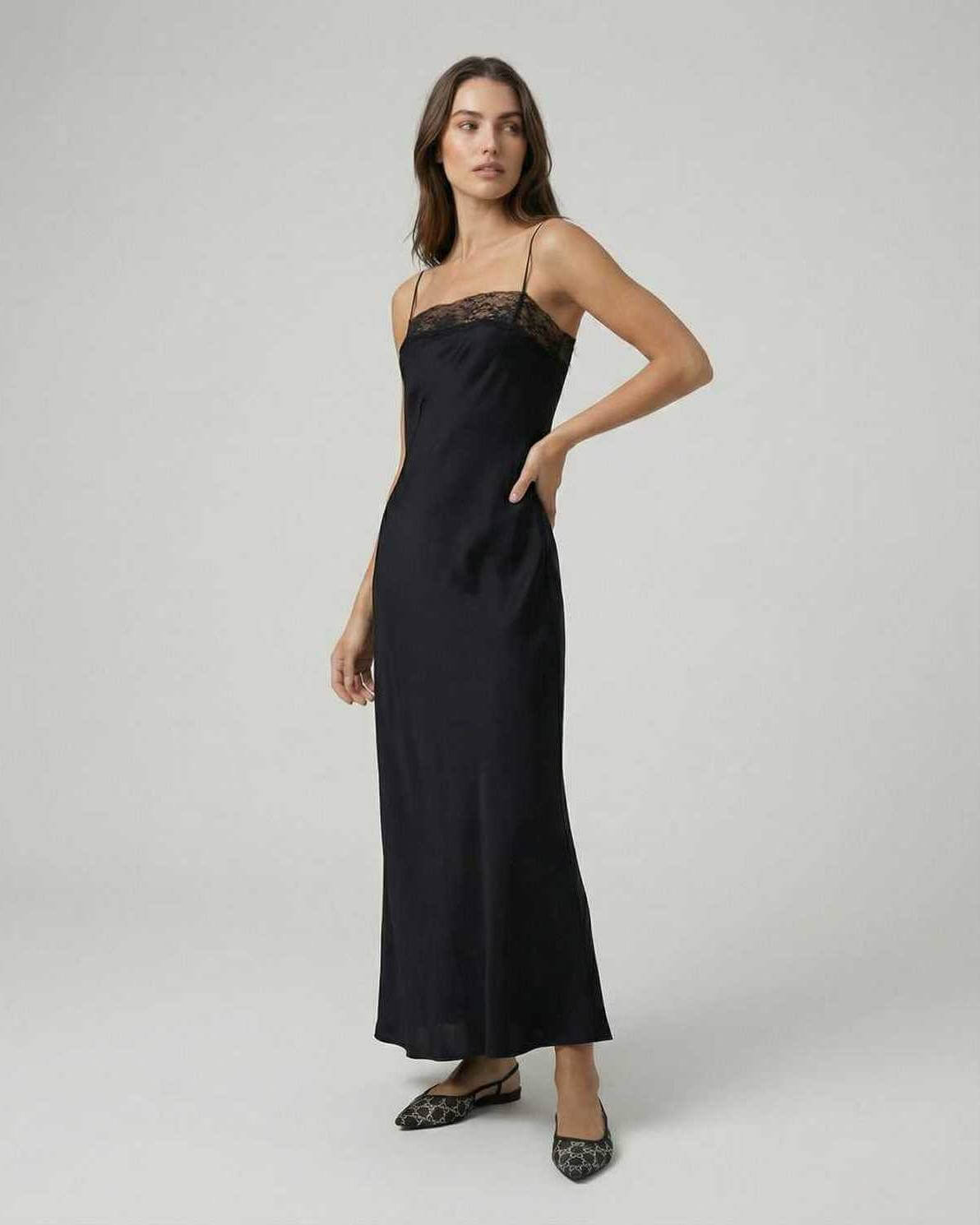 Selene Maxi Dress by Lauven features lace-trimmed neckline and spaghetti straps for a sleek look.