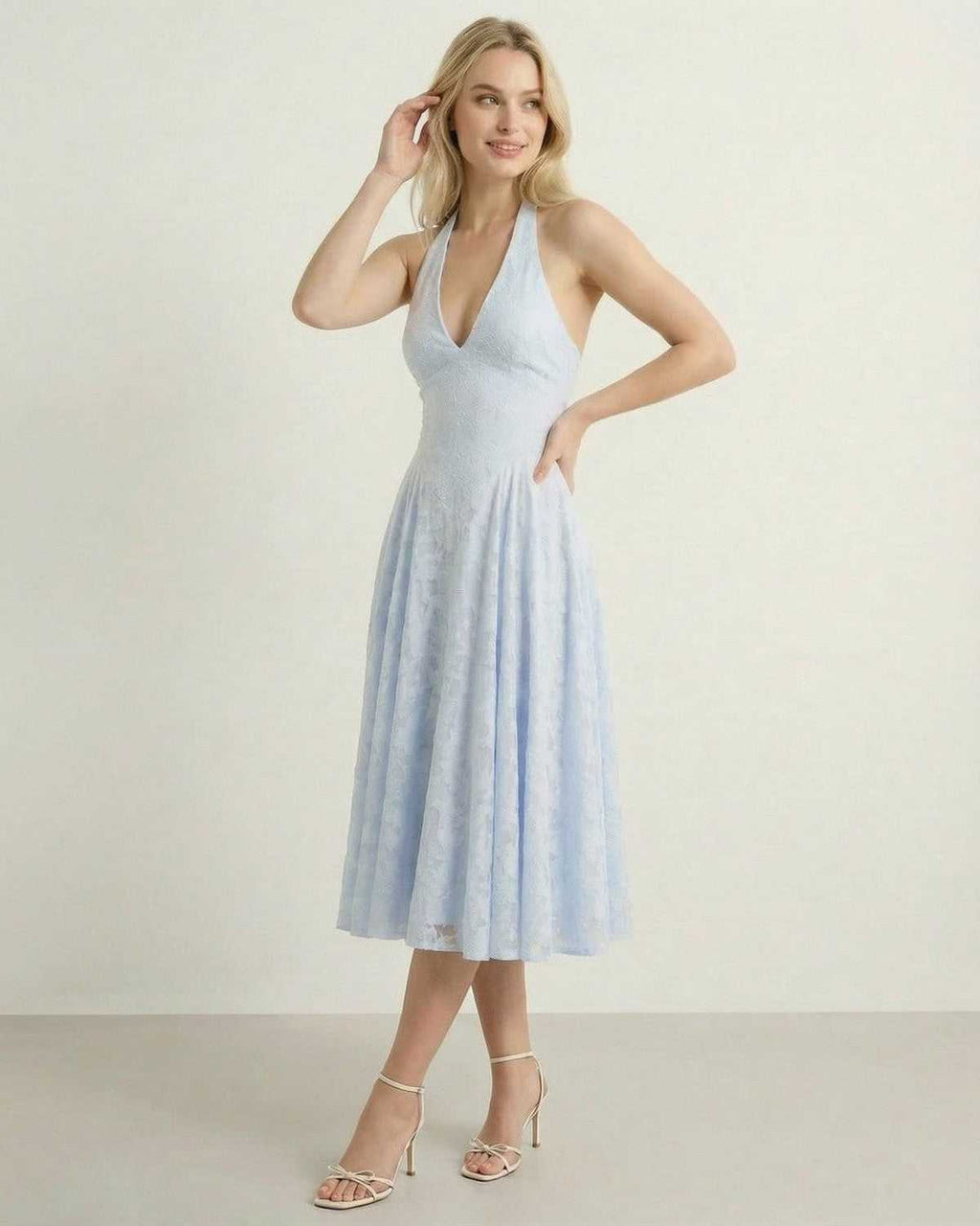 Selene Midi Dress by Lauven in light blue, featuring a halter neck and A-line silhouette.