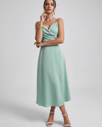 Selene Midi Dress in mint green, with satin elegance, refined spaghetti straps, perfect for weddings and cocktail events.