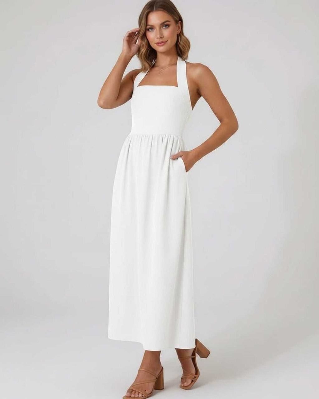 Selene Midi Dress - Elegant white halter midi dress with A-line flow, perfect for modern femininity by Lauven.