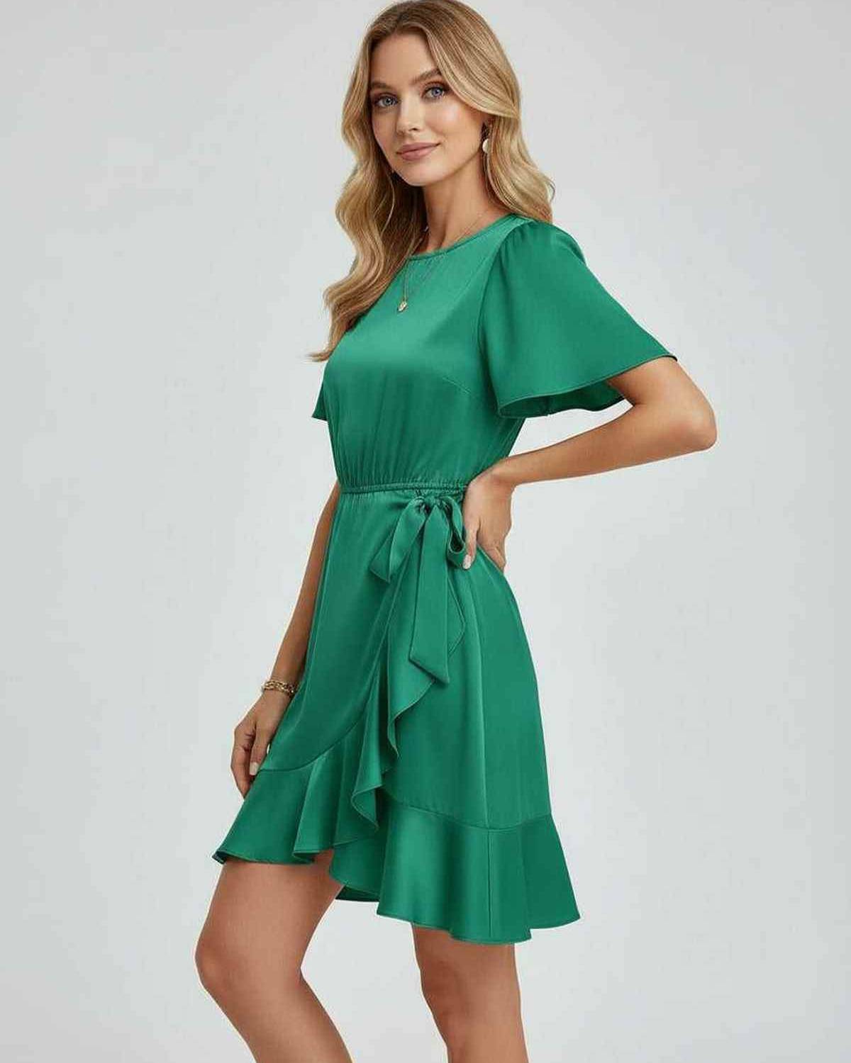 Lauven Selene Mini Dress featuring elegant ruffle detailing and tie waist in rich emerald green.