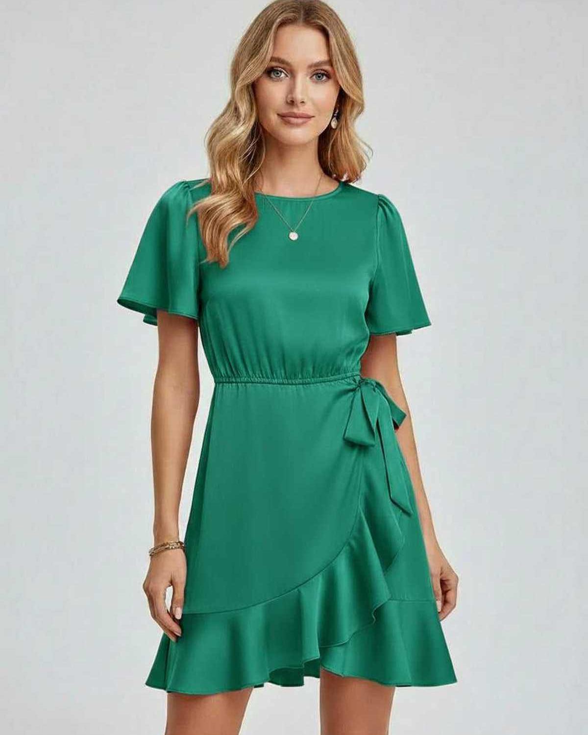 Lauven Selene Mini Dress in emerald green with elegant ruffle detailing and tie waist, perfect for spring and summer.