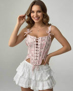 Seraphina Corset Top by Lauven in pink floral design with lace-up detail, showcasing modern elegance and structured silhouette.