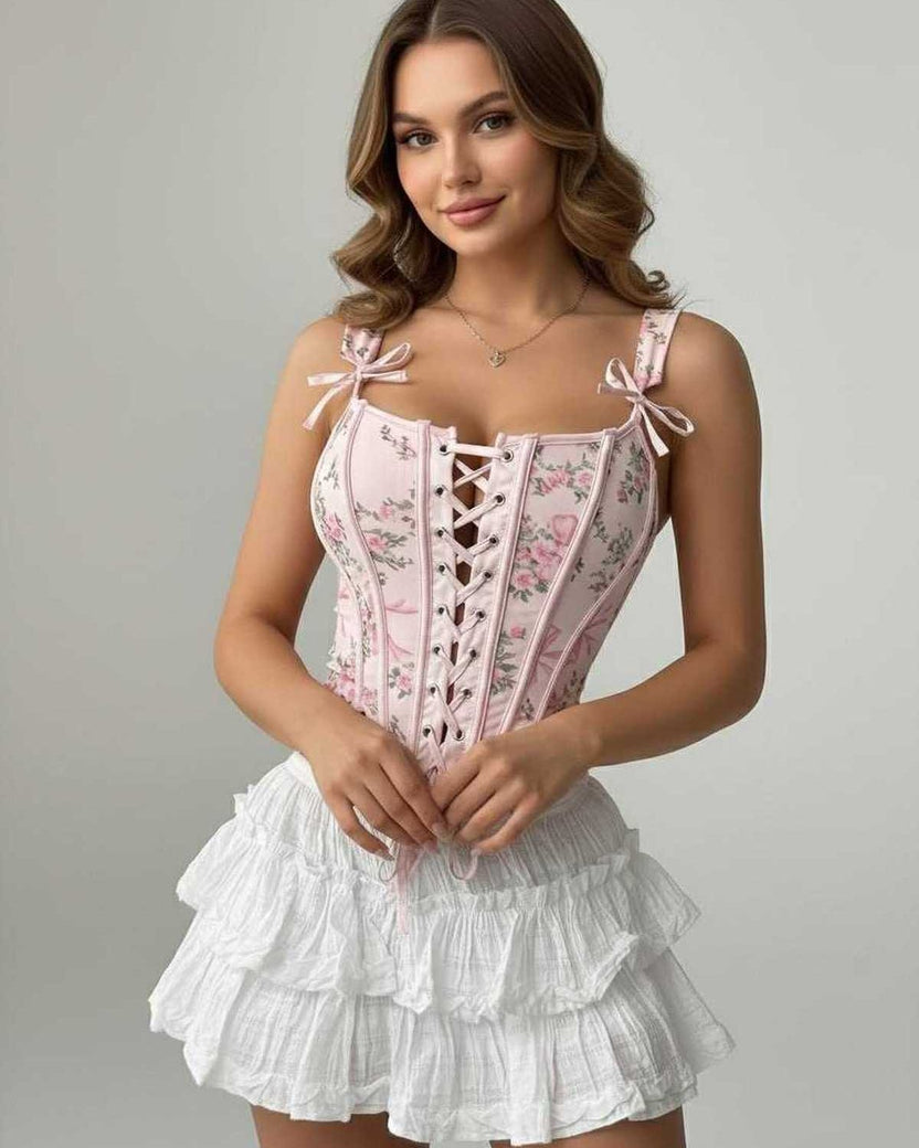 Seraphina Corset Top by Lauven, featuring pink floral lace-up design and structured silhouette.