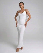 Seraphina Maxi Dress by Lauven, elegant white spaghetti strap evening dress with a modern silhouette.