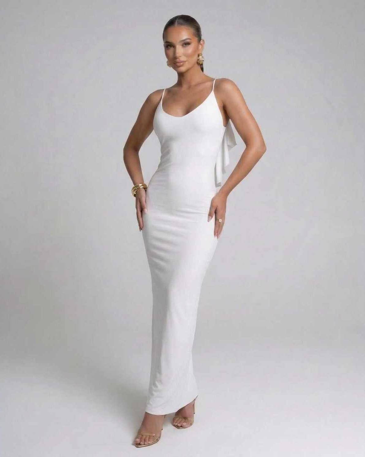 Seraphina Maxi Dress by Lauven, elegant white spaghetti strap evening dress with a modern silhouette.