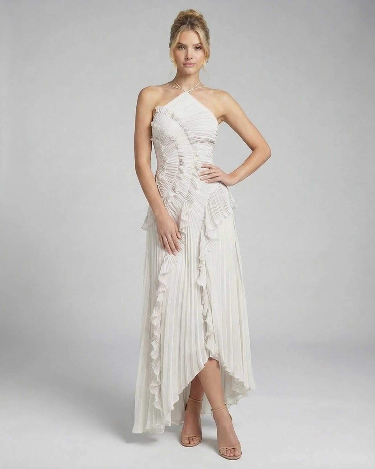Seren Maxi Dress by Lauven, elegant ivory pleated halter gown with ruffles and asymmetrical high-low design.