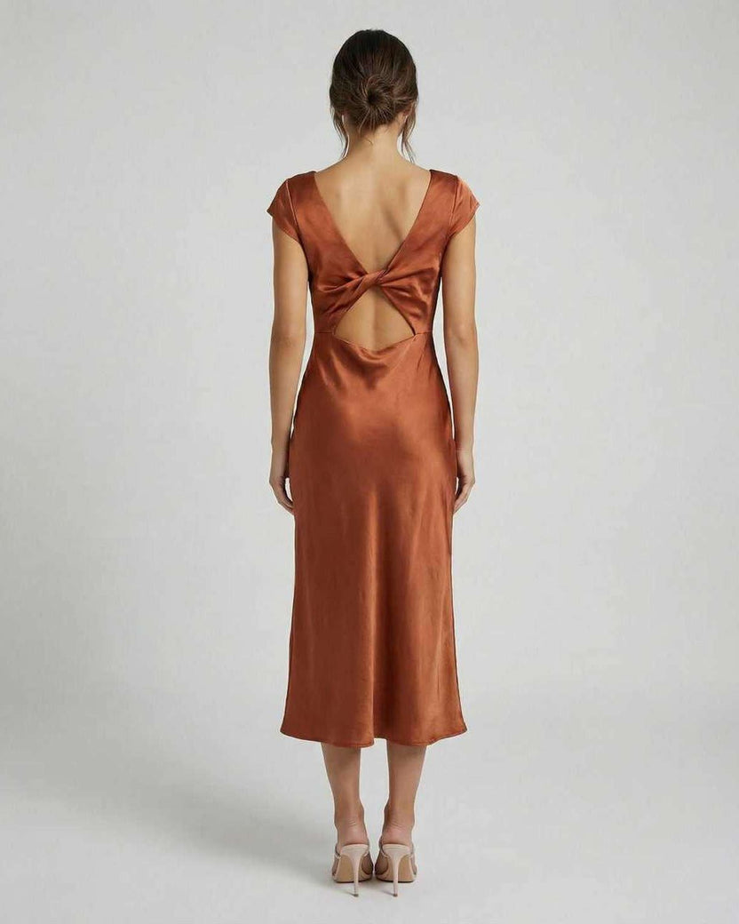 Seren Midi Dress - Elegant satin with twisted-back cutout detail in rich rust, designed for effortless sophistication by Lauven.