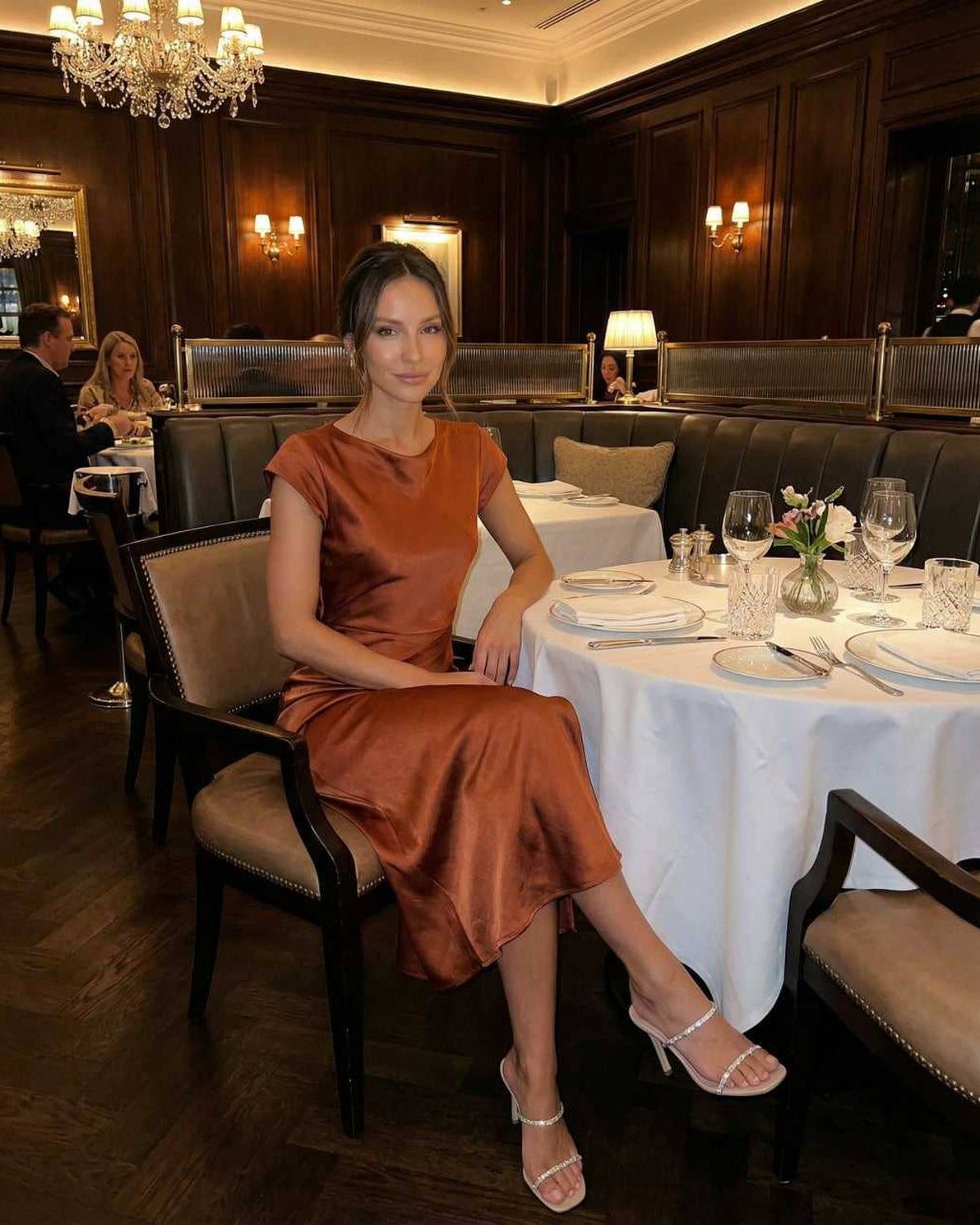 Seren Midi Dress in rich rust color, elegant satin fabric with twisted-back detail, from Lauven brand for luxury styling.