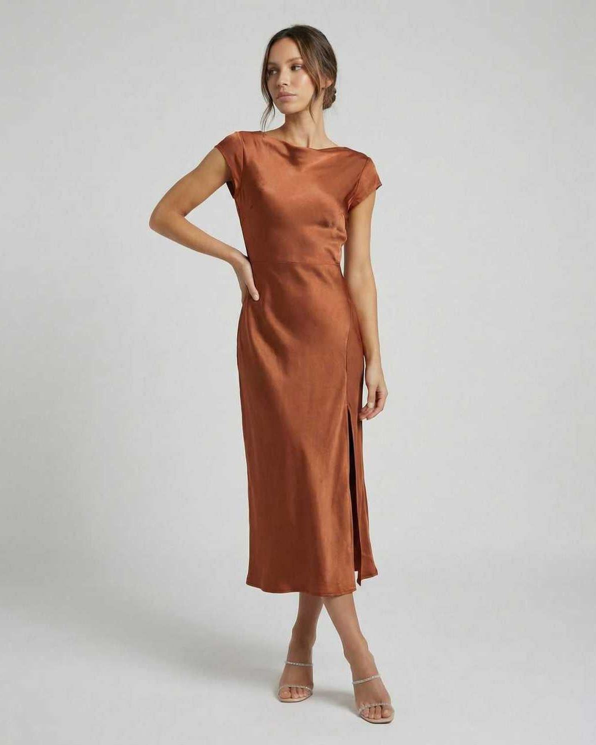 Seren Midi Dress - Elegant satin gown with twisted-back, cutout detail, rich rust color from Lauven. Effortlessly sophisticated.