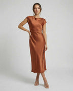 Seren Midi Dress - Elegant satin dress with twisted-back, cutout detail, and rich rust color by Lauven.