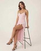 Seren Midi Dress by Lauven in soft pink featuring flirty ruffle trim and spaghetti straps, elegantly showcasing feminine charm.