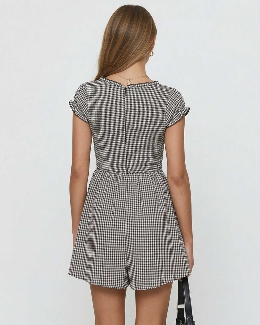 Back view of the Seren Mini Dress by Lauven featuring a gingham check pattern and cap sleeves.