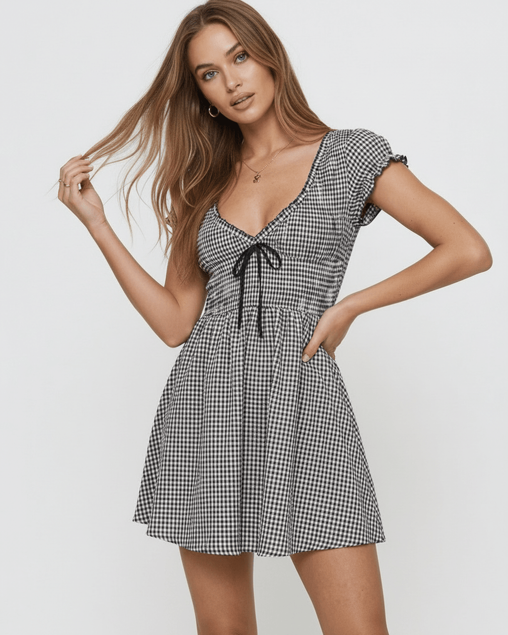 Seren Mini Dress by Lauven featuring a chic gingham check pattern, V-neckline, and flattering empire waist.