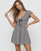 Seren Mini Dress by Lauven featuring a chic gingham check pattern, V-neckline, and flattering empire waist.