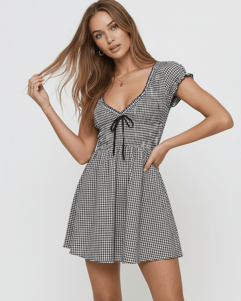 Seren Mini Dress by Lauven featuring a chic gingham check pattern, V-neckline, and flattering empire waist.
