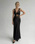 Lauven Serena Maxi Dress featuring a sleek black design with lace detailing, V-neck and elegant silhouette.