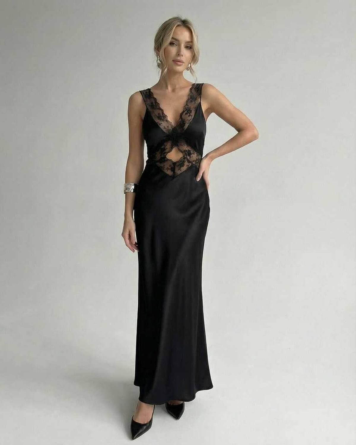 Lauven Serena Maxi Dress featuring a sleek black design with lace detailing, V-neck and elegant silhouette.