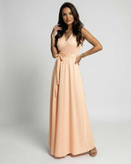 Serena Maxi Dress by Lauven in soft peach with a V-neck and wrap-style bodice, perfect for elegant occasions.