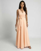 Serena Maxi Dress by Lauven in soft peach with a V-neck design and elegant flowy style.